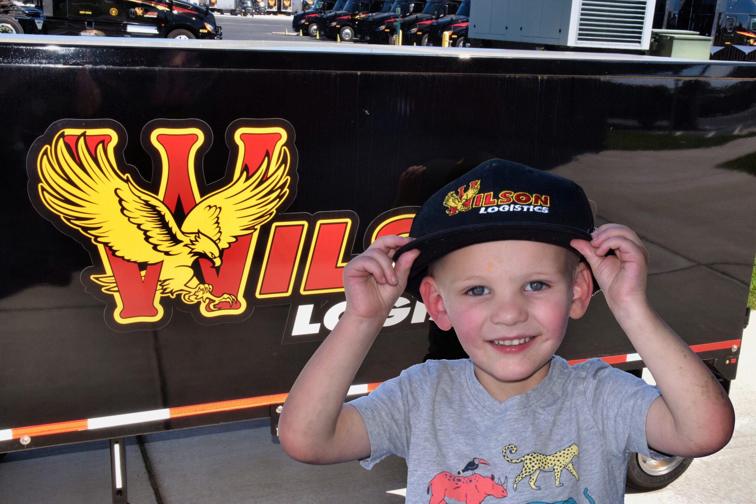 Young boy with Wilson Logistics truck